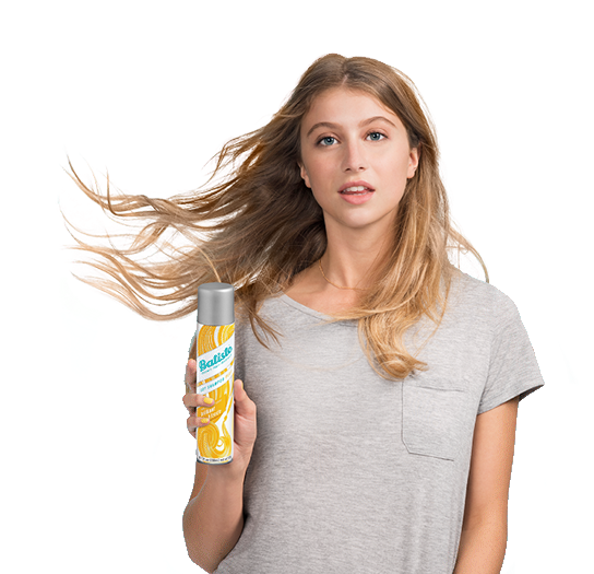 Woman showing how to use dry shampoo.