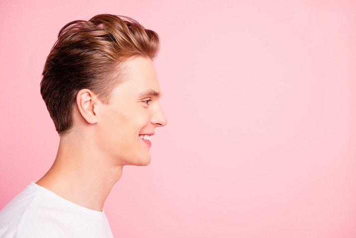 Man tames hair fly aways with dental floss