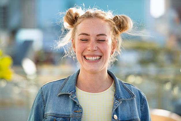 woman with space bun hairstyle post workout