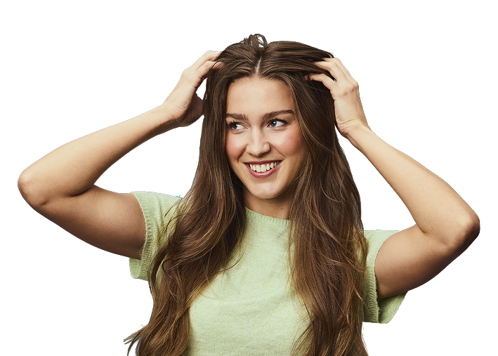 Woman putting hands in hair.