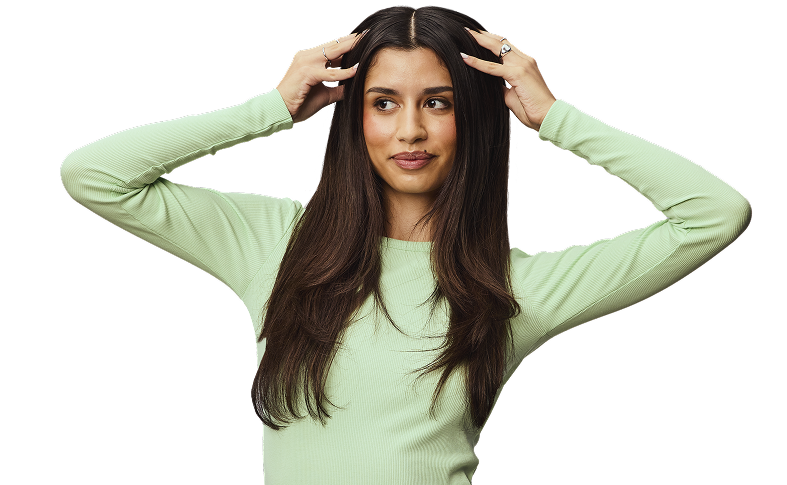 Woman putting hands in hair.