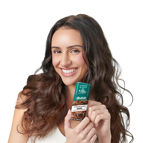 Woman post-styling her hair with dry shampoo.