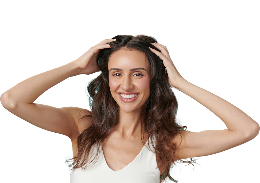 Woman putting hands in hair.