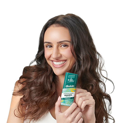 Woman post-styling her hair with dry shampoo.