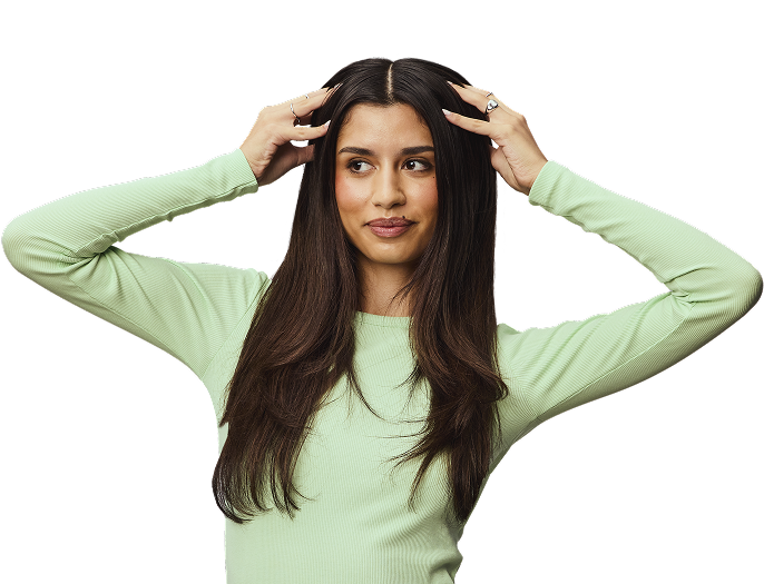 Woman putting hands in hair.