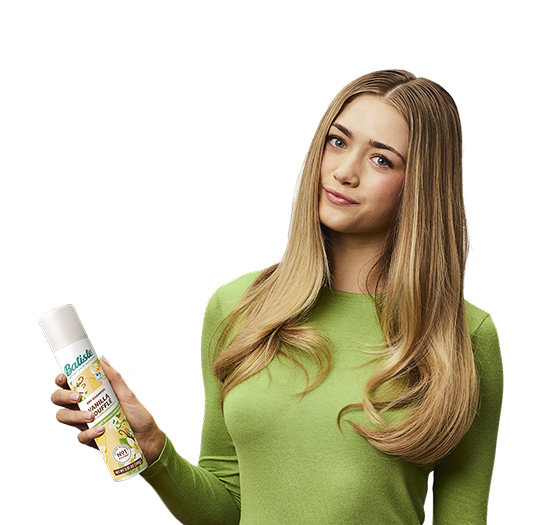 Woman showing how to use dry shampoo.